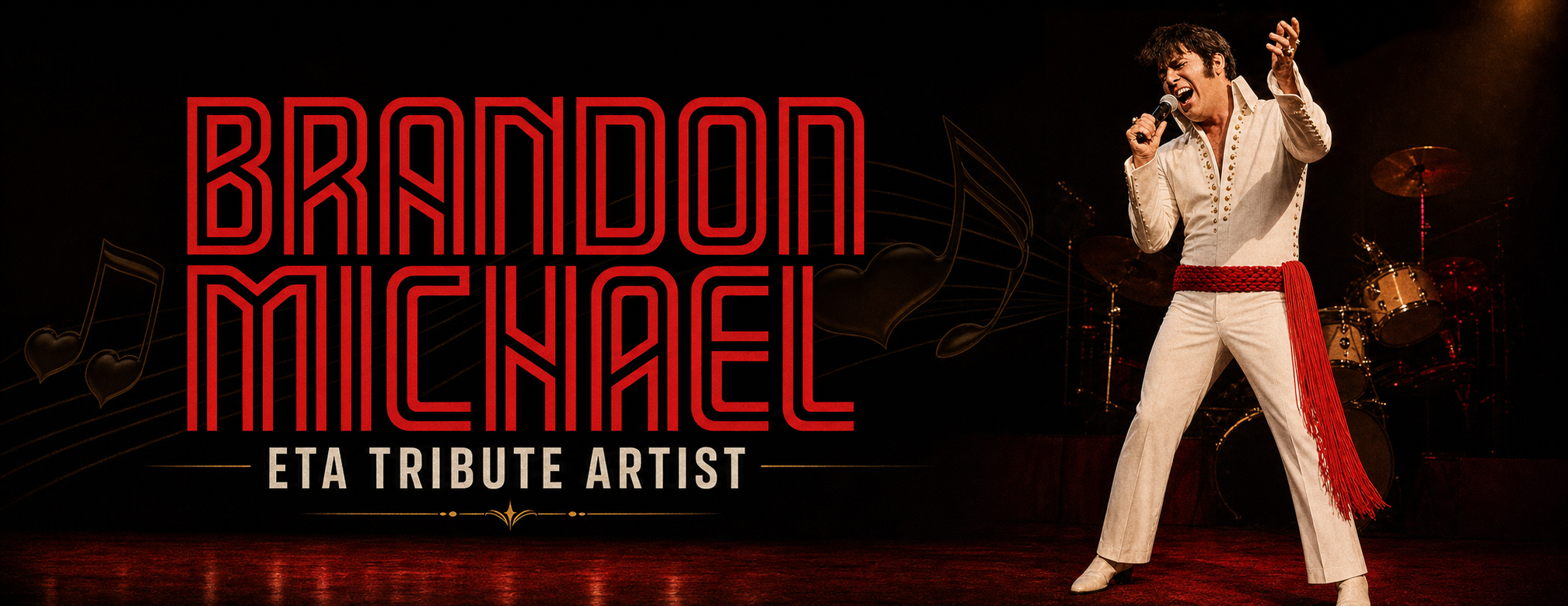 Brandon Michael performing on stage in a white jumpsuit